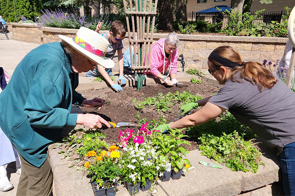 Pine Haven residents exercising with pool noodles